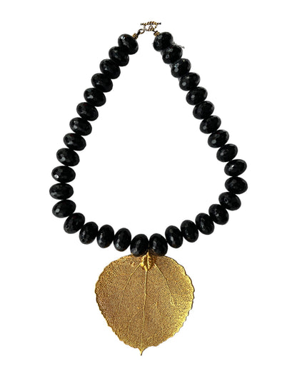 HEAVY BLACK FACETED BEAD NECKLACE w/ GILDED LEAF PENDANT