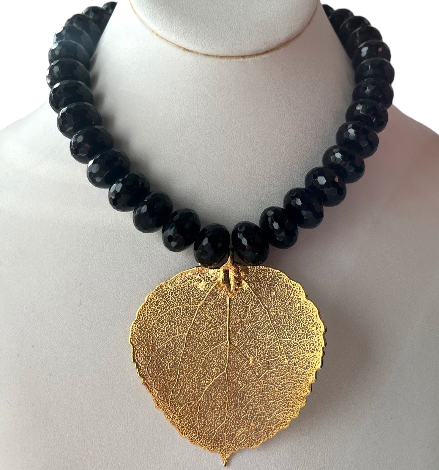 HEAVY BLACK FACETED BEAD NECKLACE w/ GILDED LEAF PENDANT