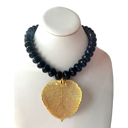 HEAVY BLACK FACETED BEAD NECKLACE w/ GILDED LEAF PENDANT