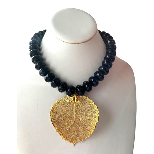 HEAVY BLACK FACETED BEAD NECKLACE w/ GILDED LEAF PENDANT